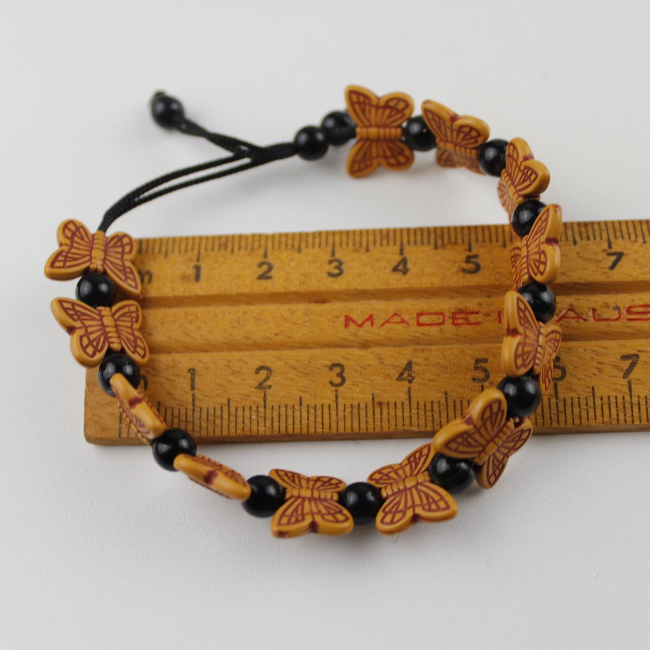 Orange Butterfly Bead Bracelet with Black Spherical Beads -