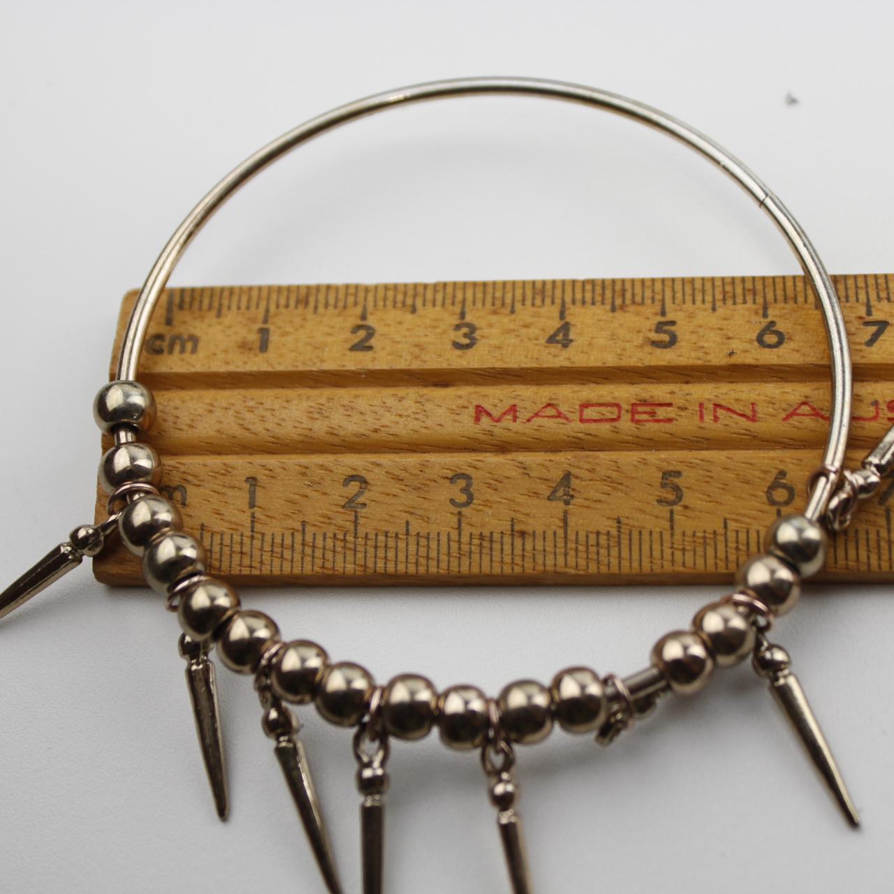 Elegant Gold Beaded Bracelet with Elongated Pendants Fashion