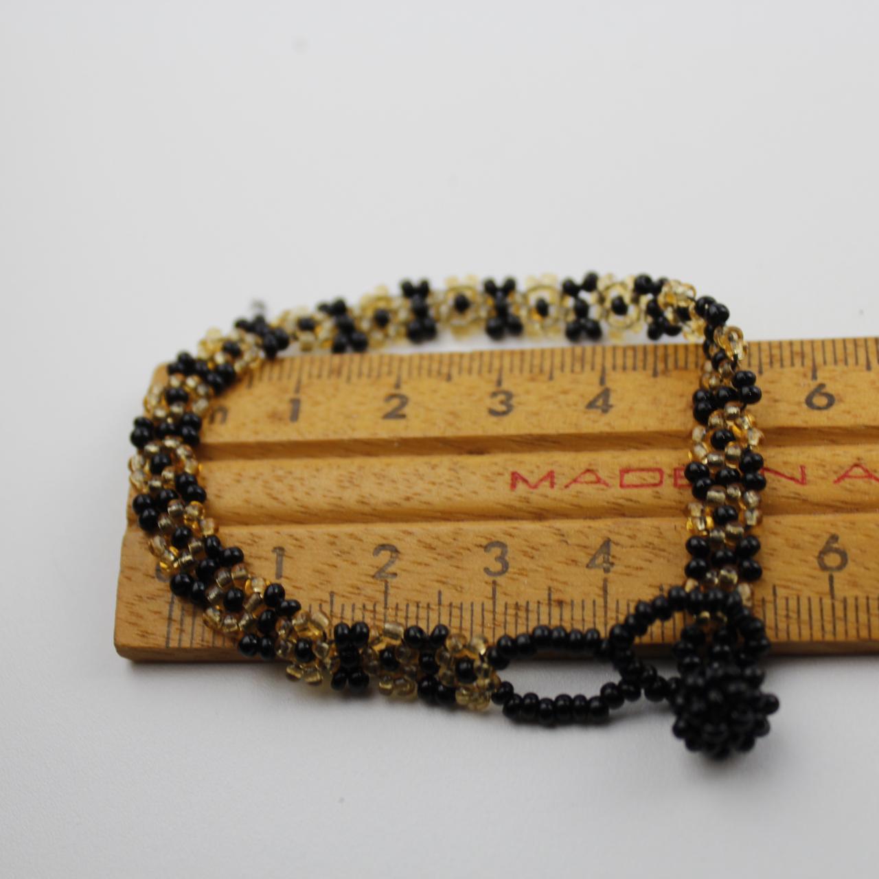Handcrafted Black and Gold Beaded Floral Bracelet Intricate