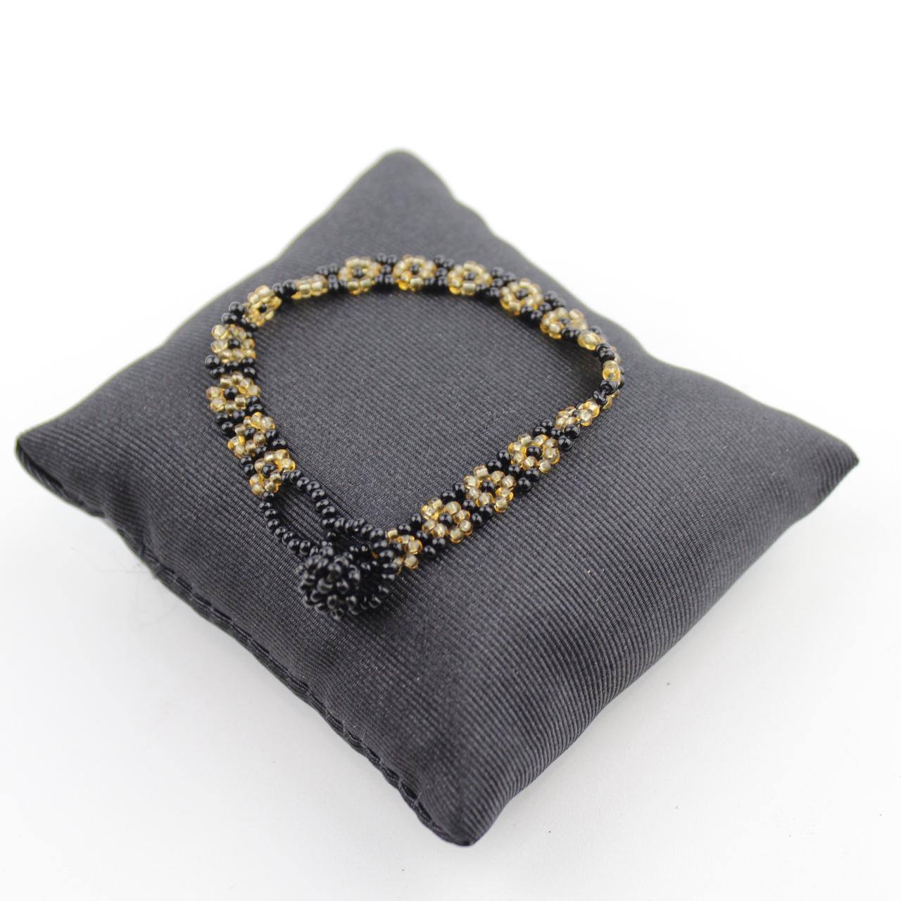 Handcrafted Black and Gold Beaded Floral Bracelet Intricate