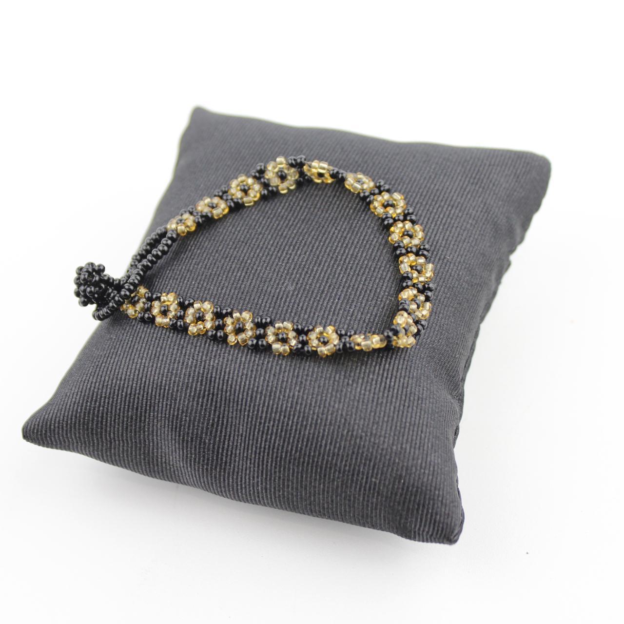 Handcrafted Black and Gold Beaded Floral Bracelet Intricate