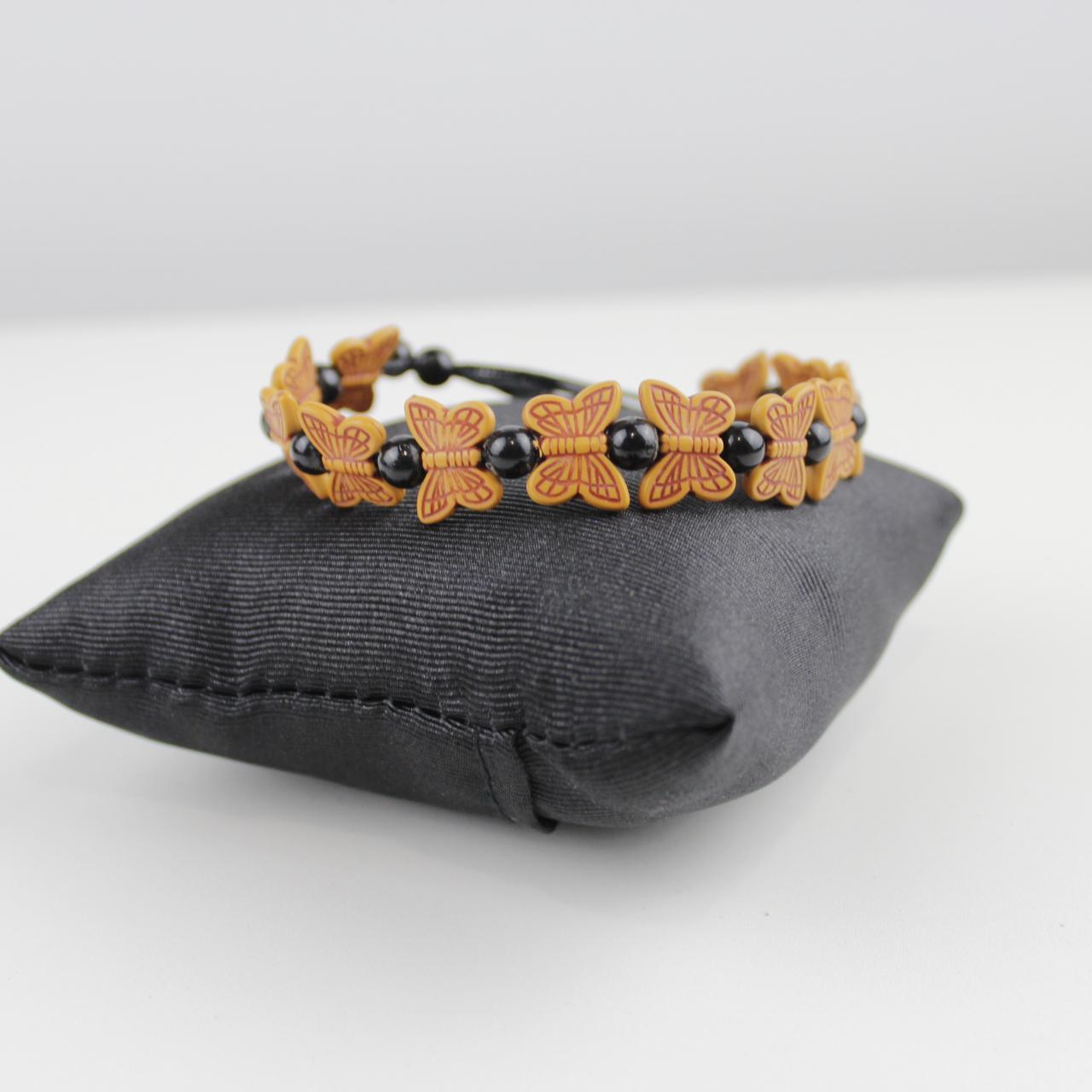 Orange Butterfly Bead Bracelet with Black Spherical Beads -