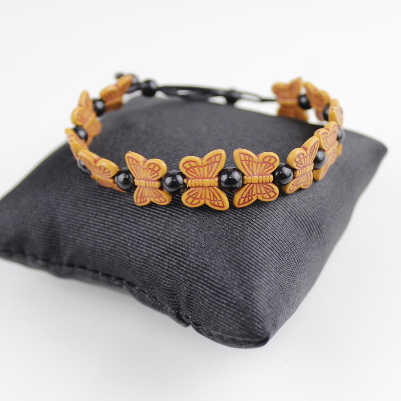 Orange Butterfly Bead Bracelet with Black Spherical Beads -