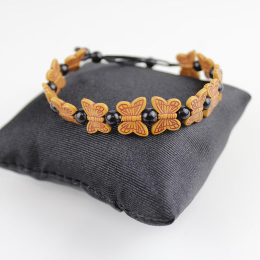 Orange Butterfly Bead Bracelet with Black Spherical Beads -
