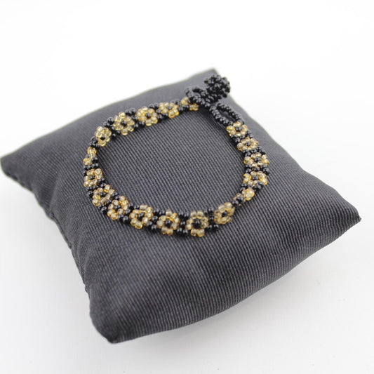 Handcrafted Black and Gold Beaded Floral Bracelet Intricate